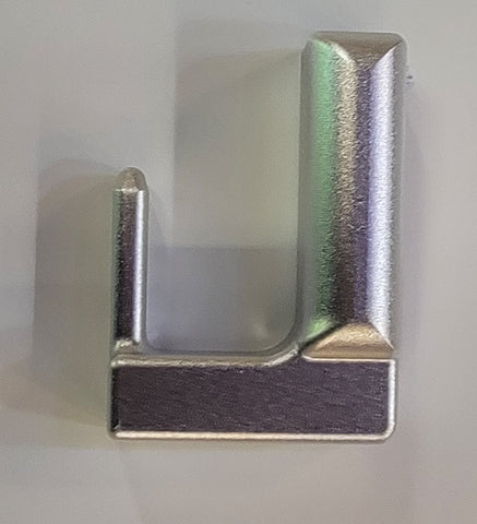 Wear plate for the "L" handle on the Unicender